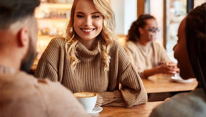 woman with fiends in cafe
