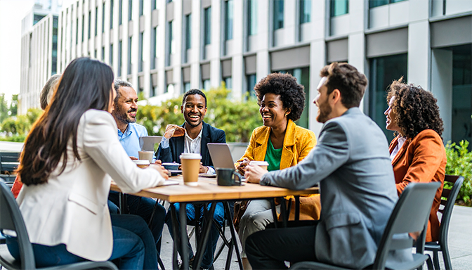 coworkers having coffee outside