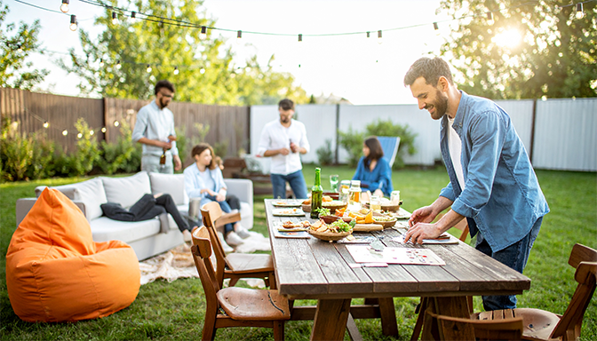 host setting up backyard game night