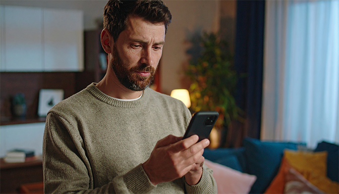 man concerned with smartphone