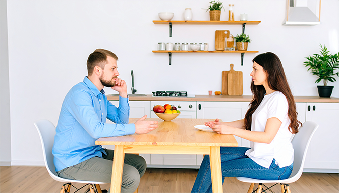 married couple having serious conversation