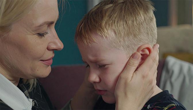 parent comforting upset child