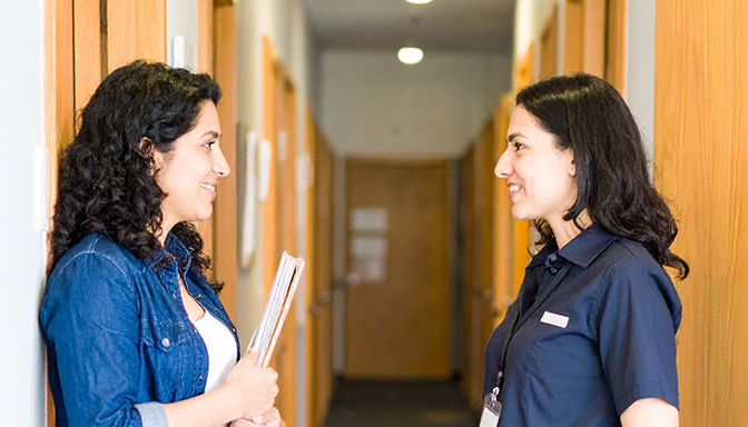 student talking with friendly RA