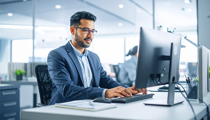 typing detailed email on computer